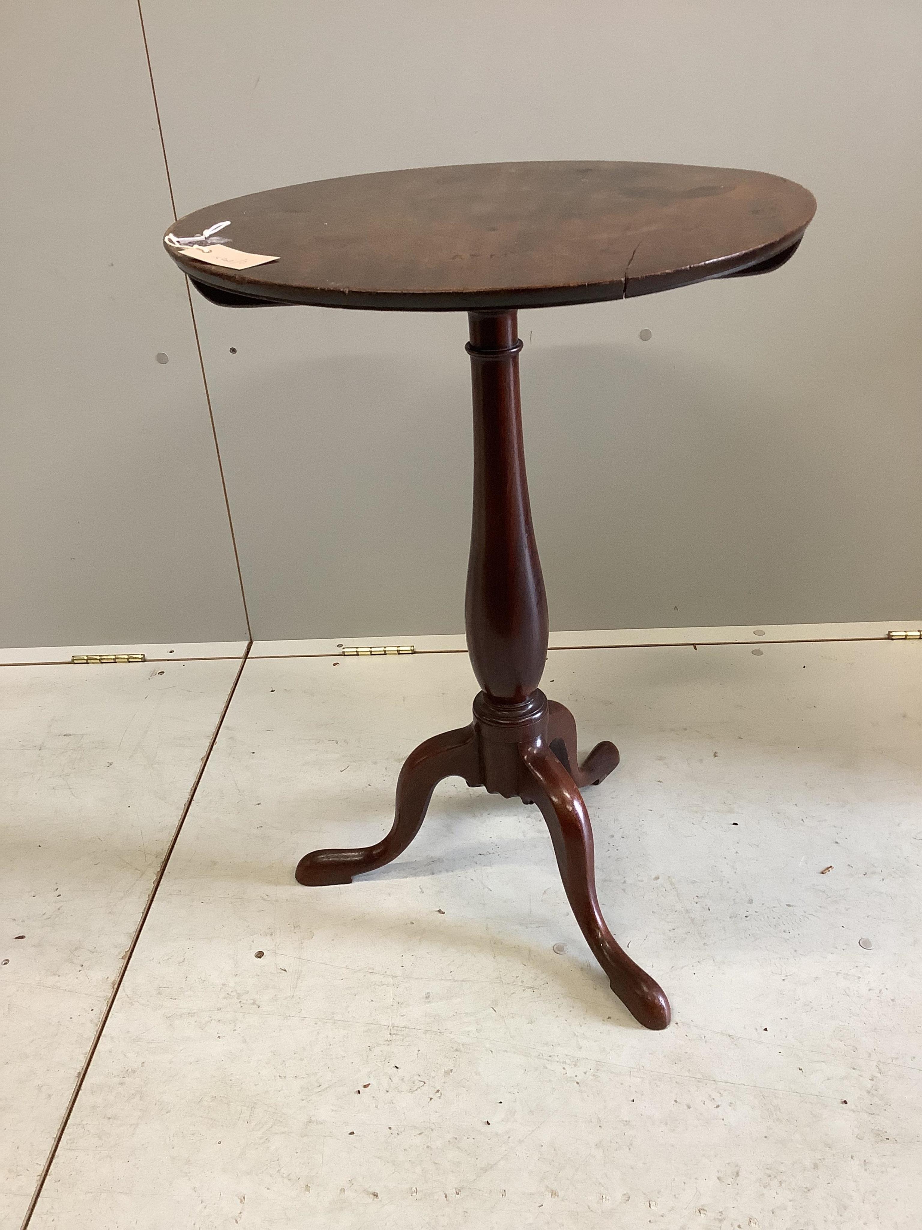 An early Victorian mahogany tilt top tripod wine table, diameter 51cm, height 71cm. Condition - fair